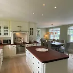 Manor House Overlooking Fields And Garden
