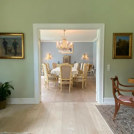 Manor House Overlooking Fields And Garden