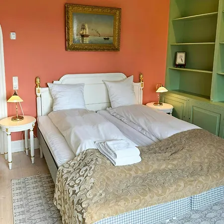 Manor House Overlooking Fields And Garden