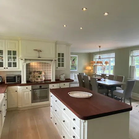 Manor House Overlooking Fields And Garden